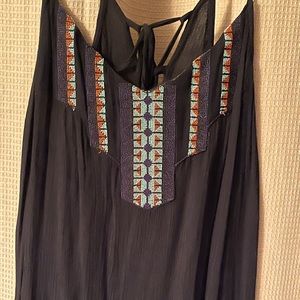 Black cover up with beaded tribal pattern. Size: Large